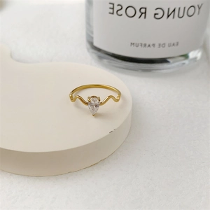 Elegant 18K gold plated thin ring with a pear-shaped teardrop diamond and wavy band