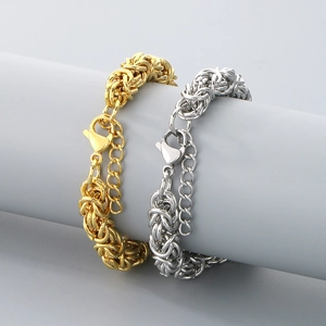 Detailed close-up of Byzantine style gold and silver stainless steel woven chain bracelets