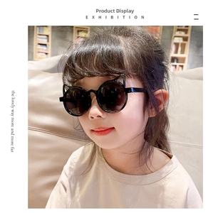 Close-up of children's cat-ear sunglasses with black round frames on an Asian child model