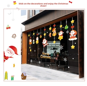 Detailed Christmas window decals showing Santa, snowflakes and Merry Christmas text