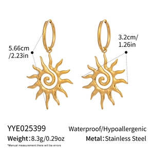 Detail of golden sun spiral earrings showing 5.66cm length and 8.3g weight parameters