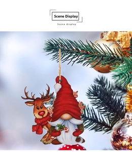 Detailed view of wooden reindeer and gnome ornaments hanging on a Christmas tree