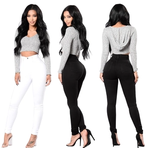 Women's high waist slim fit denim pants paired with a grey cropped hooded sweatshirt