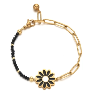 Detail of bohemian daisy bracelet with gold rectangular links and black faceted beads