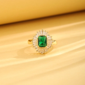 Adjustable 18K gold plated ring with emerald cut green crystal and tapered zircons
