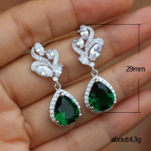 Retro pear-cut emerald teardrop earrings with white zircon accents in silver setting