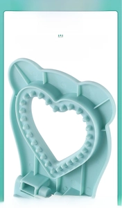 Macro detail of heart-shaped sandwich sealer with professional sealing gear design