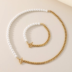 Detail of mixed pearl and gold Cuban chain necklace and bracelet set with OT clasp