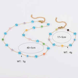 Detail view of colorful crystal beaded stainless steel necklace and bracelet set