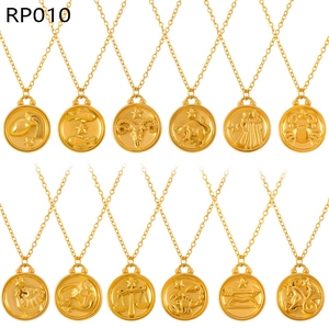 Detail of 12 zodiac embossed coin pendants in gold finish on minimalist link chains