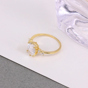 Detail of S925 hallmark on gold plated silver ring with oval cubic zirconia stone