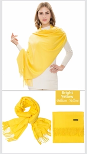 Detail of Billian Yellow cashmere scarf showing soft texture and fringe tassels