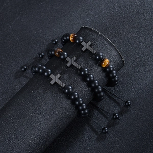 Tiger eye and matte bead cross pendant bracelet set for men on black display