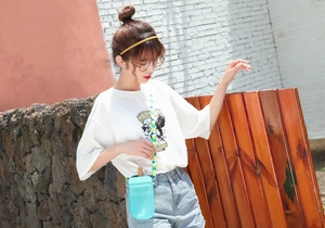 Detail of blue transparent crossbody water bottle bag with ice pop design and shoulder strap