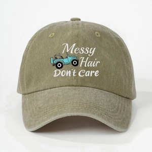 Detail of vintage green washed cotton baseball cap with Messy Hair Don't Care print