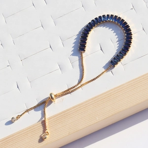 Adjustable gold chain necklace featuring a row of dark blue rectangular zircon stones