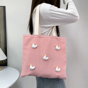 Striped canvas tote bag for women featuring cute white duck doll ornaments on a red pattern