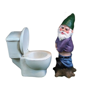 Funny garden gnome sitting on a toilet statue made of resin for outdoor Christmas decor