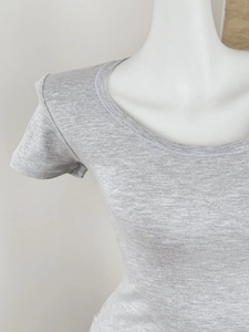Close-up of the grey knit texture and ribbed neckline of this slim-fit short sleeve T-shirt