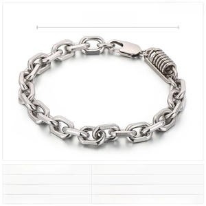 Macro detail of high-polished stainless steel punk bracelet with woven chain links