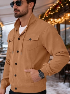 Detail of vintage yellow corduroy jacket featuring ribbed texture and button chest pocket