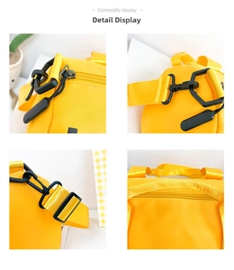 Detailed view of yellow nylon bag featuring smooth zippers, plastic hooks, and durable straps