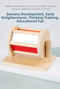 Detail of wooden sensory spinning drum with mirrors and colorful panels for early education