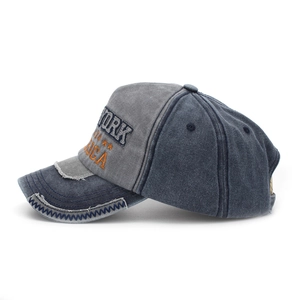 Detail of vintage patchwork denim baseball cap with NEW YORK embroidery and zigzag stitching