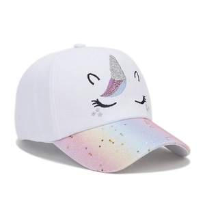Detail of embroidered unicorn pattern and rainbow sequins on children's baseball cap