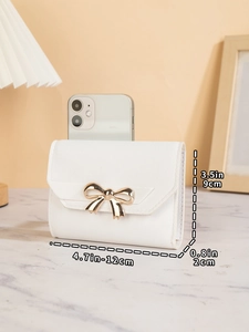 Mini white bow wallet size dimensions 12x9x2cm compared to a smartphone display