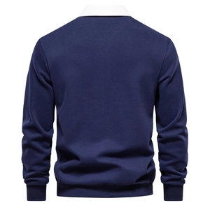 Detail view of the back of a navy polo sweatshirt with white collar and ribbed cuffs