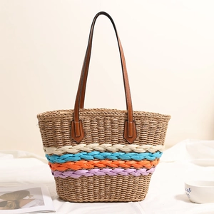 Bohemian straw shoulder bag featuring colorful rainbow stripes for beach vacations