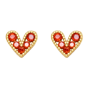 Macro detail of heart stud earrings with gold plating and pavé red cubic zirconia gems