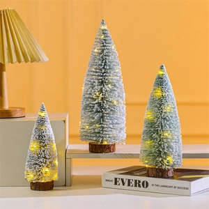 Three-piece mini flocked Christmas trees with warm LED lights and wooden bases