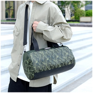Detailed view of the large camouflage sports bag with adjustable shoulder strap and logo