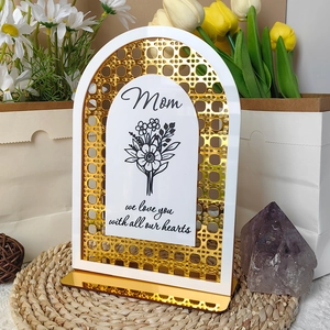 Detail view of Mom acrylic desk decor with gold base and floral engravings