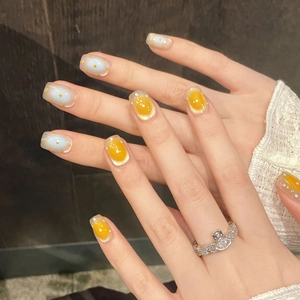 Blue and yellow handmade press-on nails with wave dot cat-eye and egg pattern design