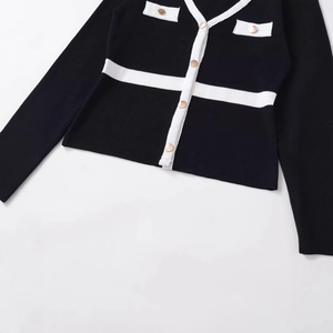 Elegant black knit cardigan with white contrast trim and gold buttons for women