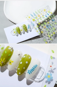 Detail of floral nail art stickers TS-1331 with green leaf patterns on olive nails