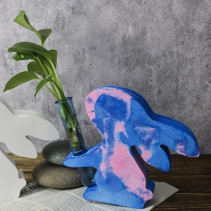 Detail of bunny hydroponic vase mold with marble texture and a glass test tube insert