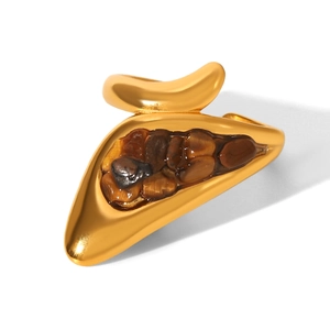 Detailed close-up of 18k gold-plated stainless steel ring with multiple tiger eye stones