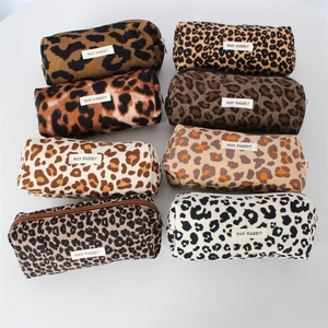 Close-up of leopard print makeup pouches in eight colors with durable metal zippers