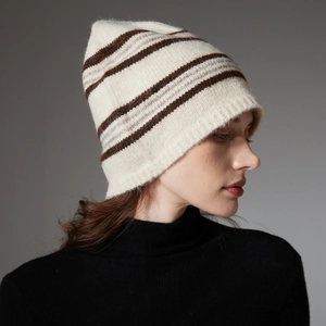Unisex beige striped wool knit beanie hat for winter, side view on model