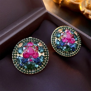 Vintage gold clip-on earrings with colorful rhinestones and rose red center stone