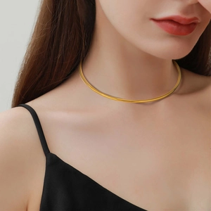 Minimalist 18K gold plated stainless steel choker necklace shown on model neck