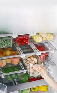 Drawer-style hanging fridge organizer in transparent plastic for egg and vegetable storage