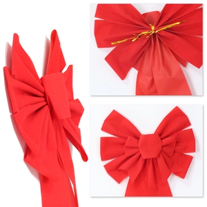 Detailed three-view display of a large red velvet Christmas bow with gold twist ties
