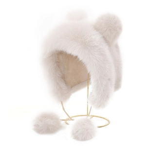 Sweet faux fur winter hat with bear ears and pom-pom earflaps in cream white