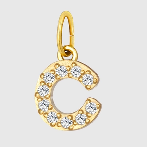 Macro shot of gold letter C pendant with sparkling pave cubic zirconia setting