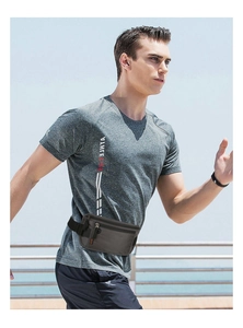 Running waist bag on a male runner with adjustable belt in an outdoor setting